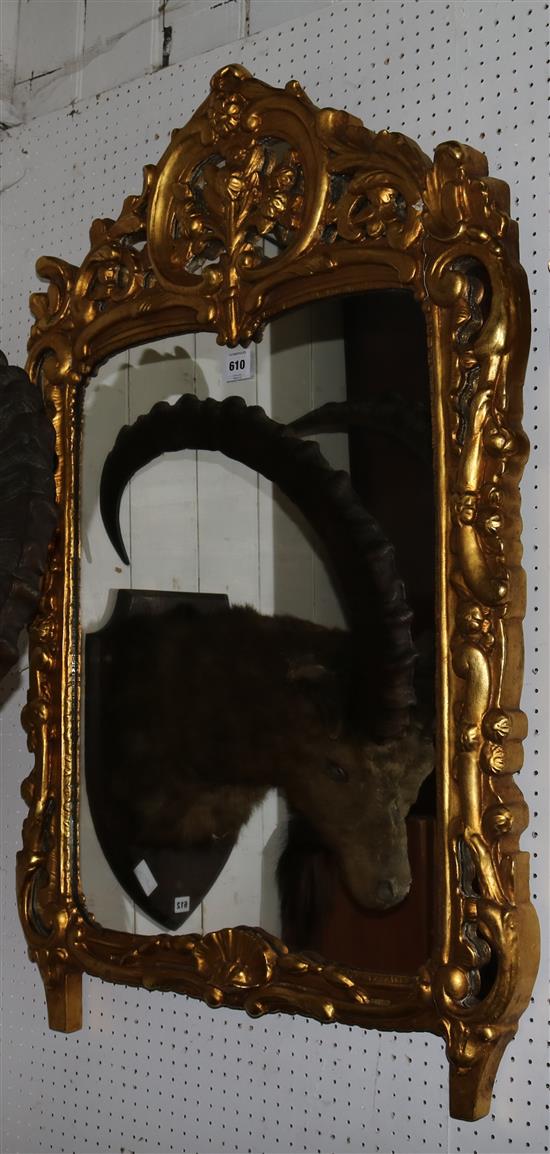 A mid 18th century Italian style carved giltwood wall mirror, the plate 2ft 2in. x 1ft 8in.
